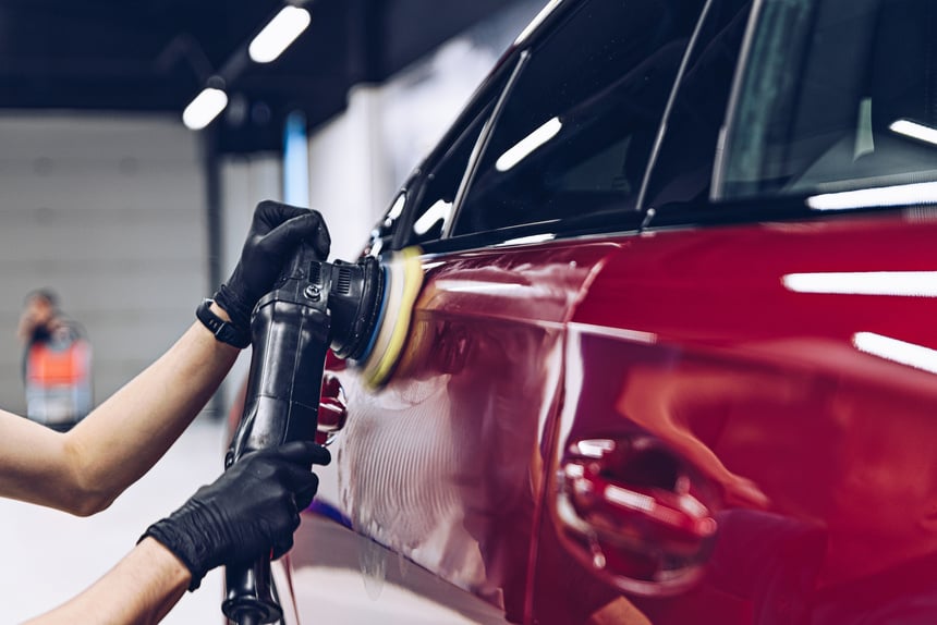 Man polishing car paint