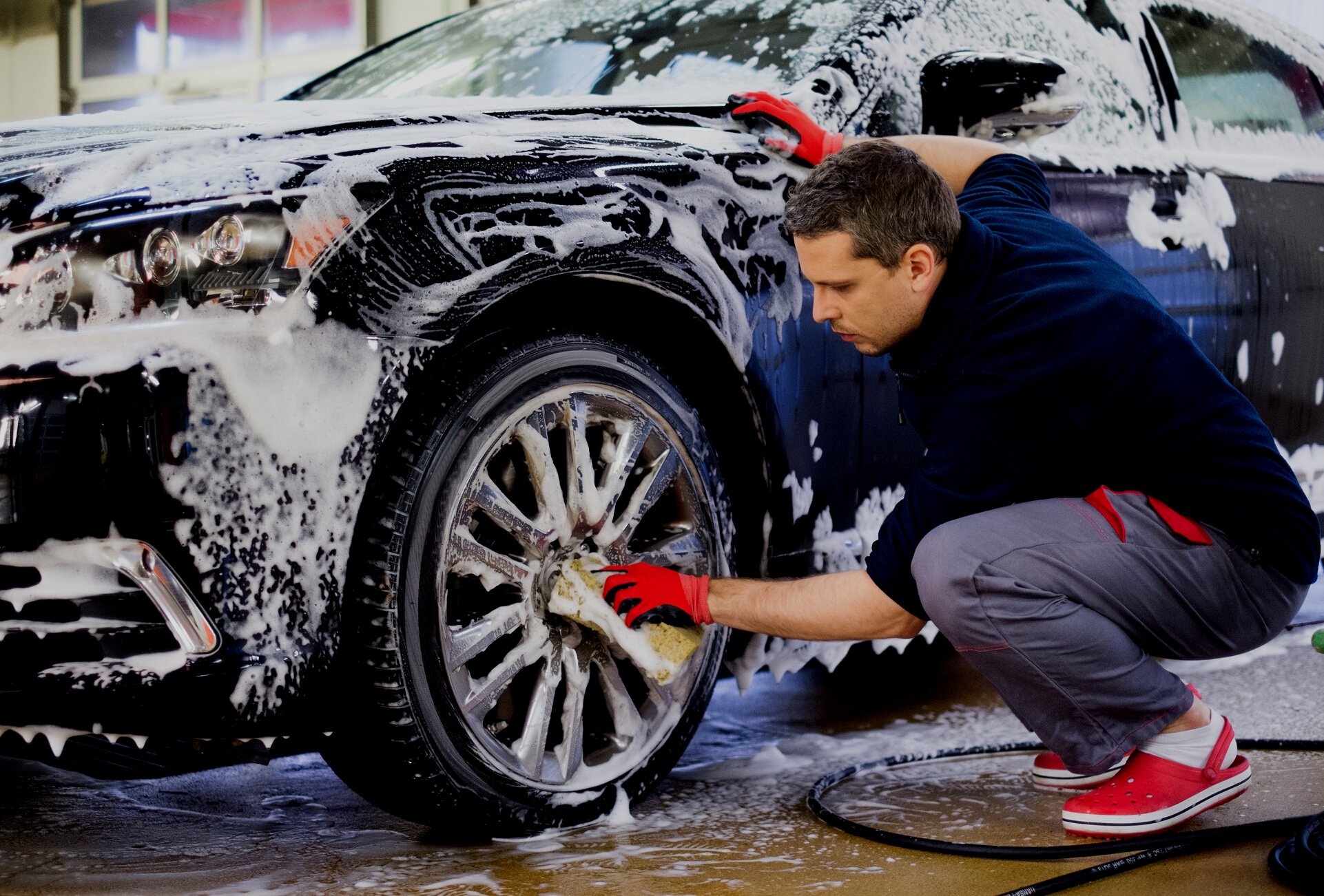 Worker Washing Car