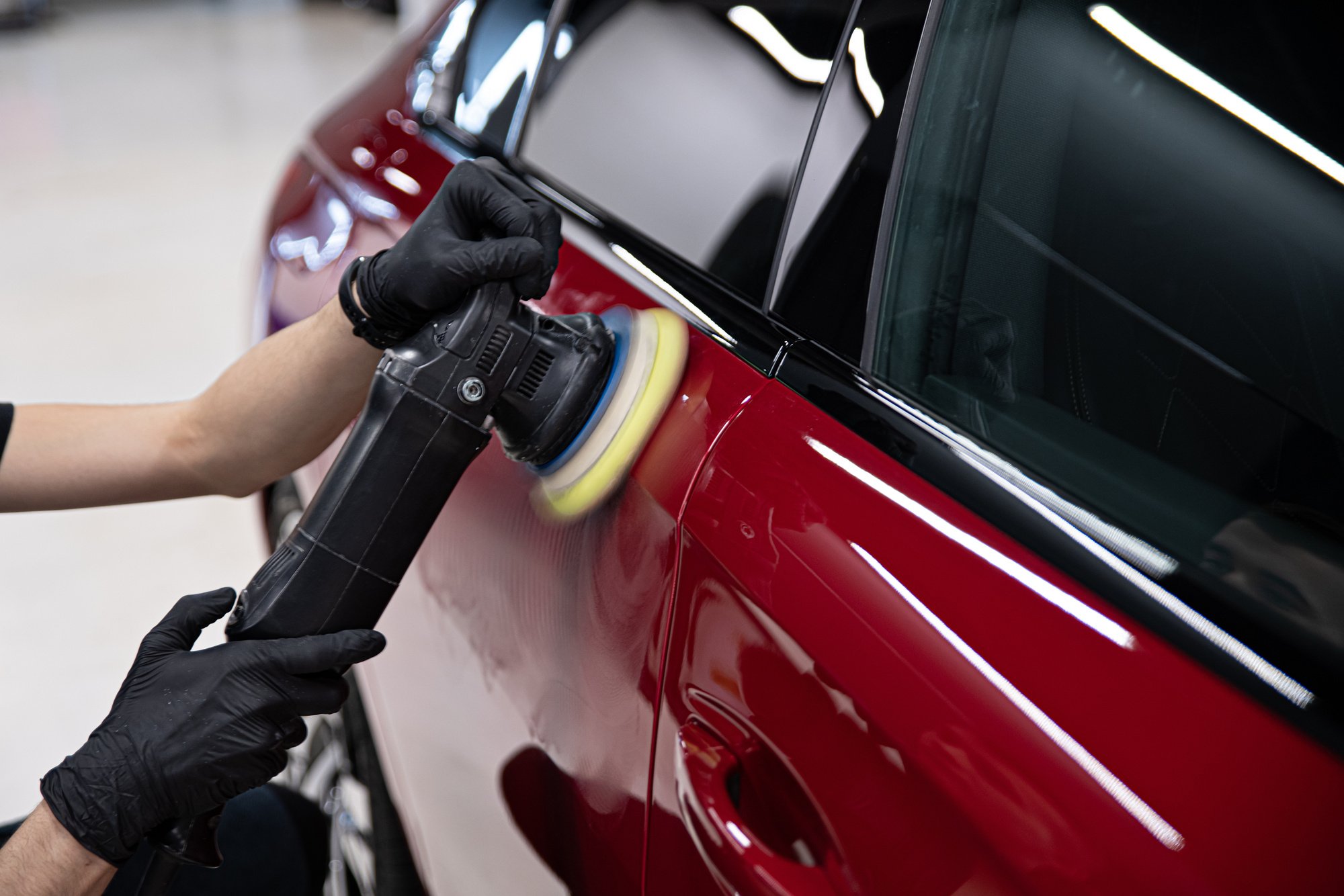 Man polishing car paint